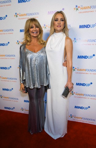 Actress and host Goldie Hawn poses with her daughter and actress Kate Hudson at the inaugural "Goldie's Love In for Kids" benefit event in Beverly Hills