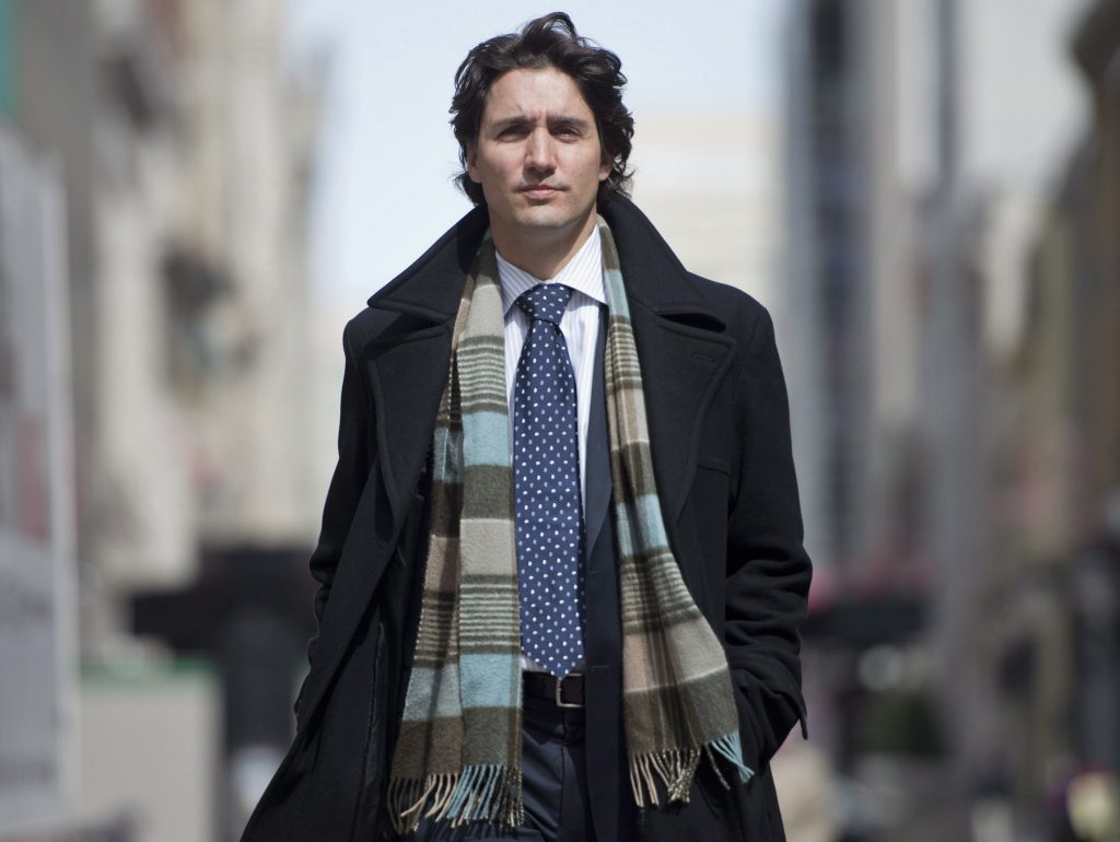 Liberal leadership candidate Justin Trudeau walks down the street after speaking with The Canadian Press, Thursday, April 11, 2013 in Ottawa. THE CANADIAN PRESS/Justin Tang