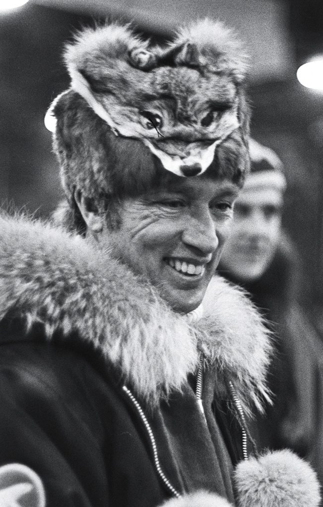Prime MInister Pierre Trudeau in parka and Muskrat hat topped with the head of a Wolverine lands in Ottawa following a six-day tour of the North West Territories. (CP PHOTO/ Peter Bregg)