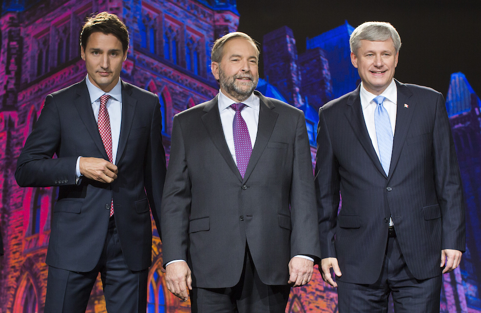 Justin Trudeau, leader of the Liberal Party of Canada, from left, Thomas "Tom" Mulcair, leader of the New Democratic Party, and Conservative Leader Stephen Harper, Canada's prime minister, stand for a photograph prior to the second leaders' debate in Calgary, Alberta, Canada, on Thursday, Sept. 17, 2015. The debate pits Harper and his Conservative Party's program of tax cuts and spending restraint against the Liberal Party's Trudeau who is pledging to raise taxes on the highest earners and Mulcair of the New Democratic Party who advocates increasing levies on corporations. Photographer: Ben Nelms/Bloomberg via Getty Images