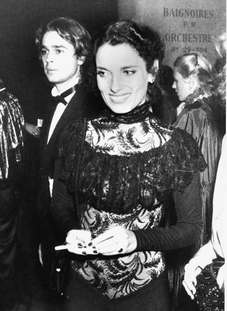 Former First Lady of Canada Margaret Trudeau, estranged wife of Pierre Trudeau, smiles and holds a cigarette at the gala opening of the International Festival of Dance and Theatre at the Champs-Elysees, Paris, France, October 19, 1978. An unidentifed man in a tuxedo stands near her. (Photo by Pictorial Parade/Getty Images)