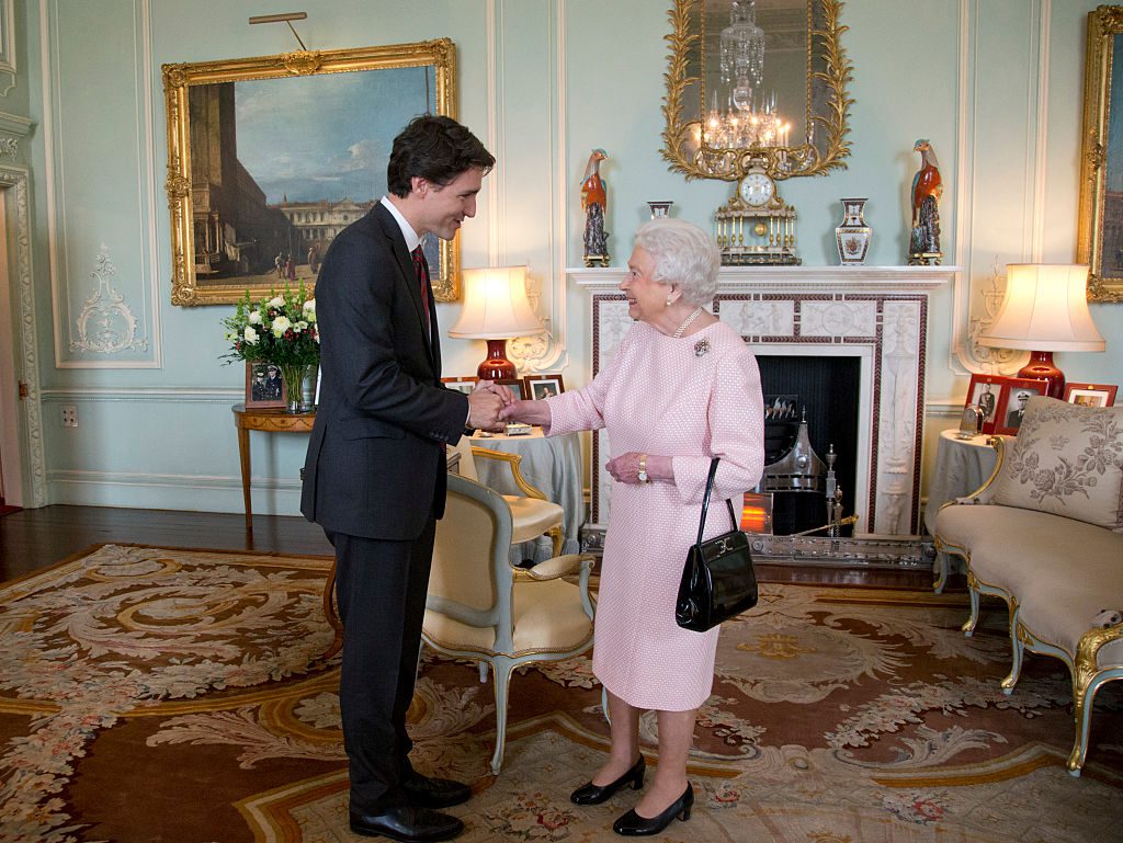 LONDON, UNITED KINGDOM - NOVEMBER 25: Prime Minister of Canada Justin Trudeau shake hands with Queen Elizabeth II during a private audience at Buckingham Palace on November 25, 2015 in London, England. This is the first visit of Trudeau in Britain since his election as Canadas Prime Minister. (Photo by Yui Mok - WPA Pool/Getty Images)