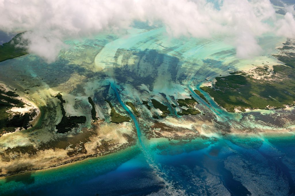 Aerial view of islands, coral and tidal channels at the coast, Aldabra, Seychelles