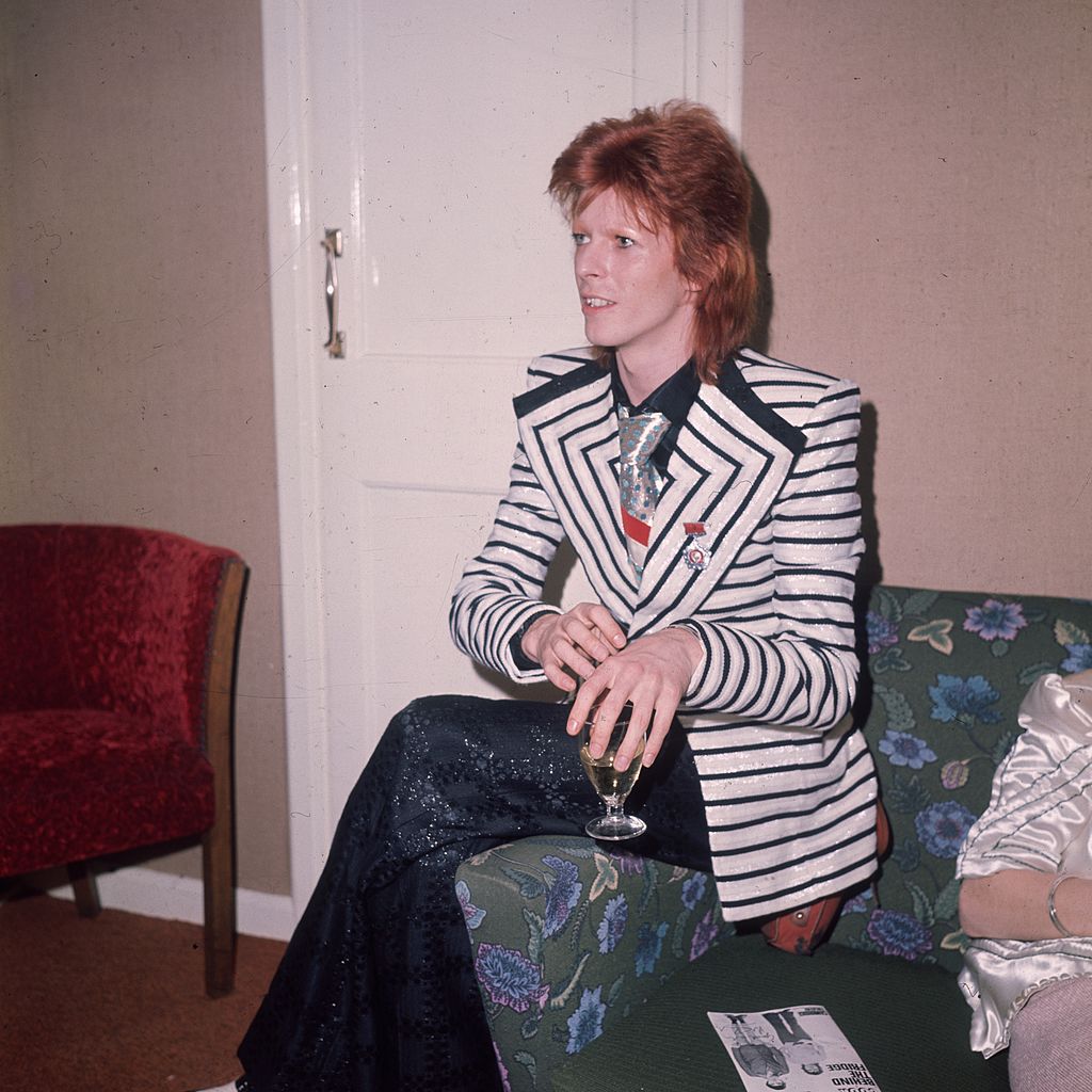 May 1973: In a black and white horizontally striped jacket with wide lapels glam rock star David Bowie. (Photo by Hulton Archive/Getty Images)