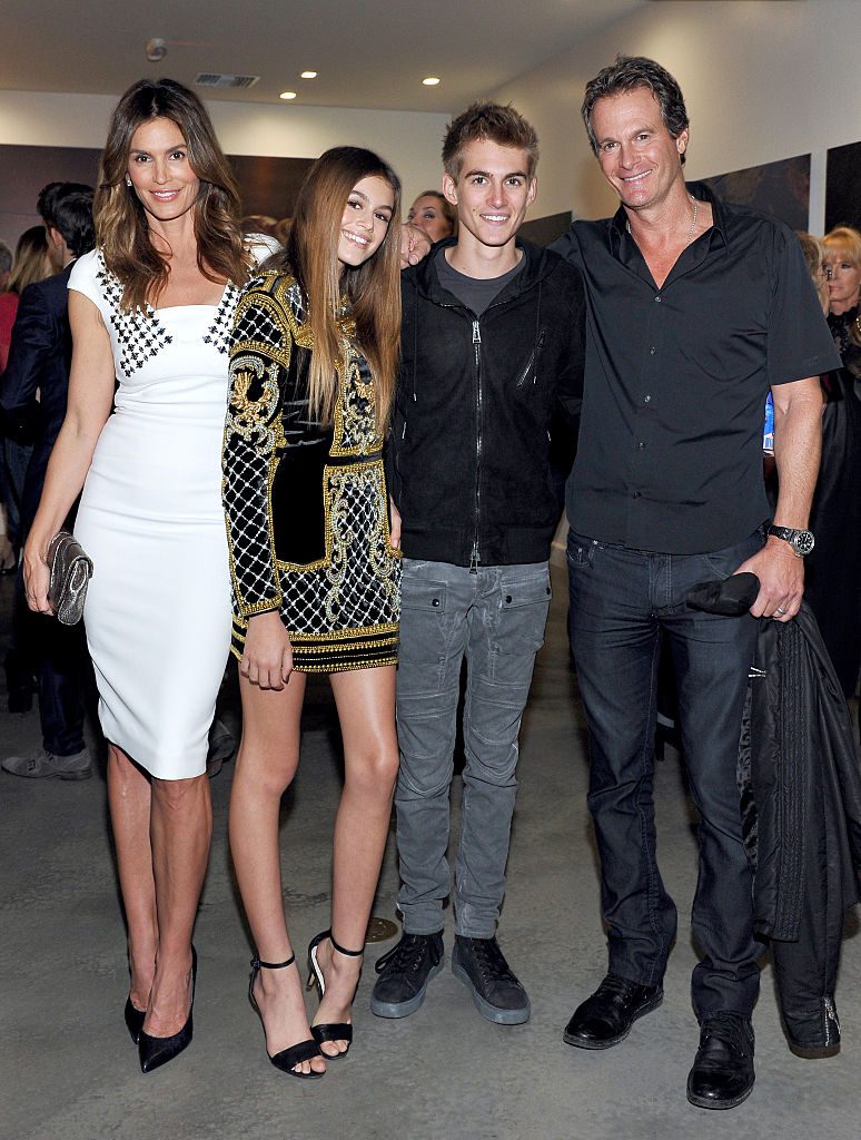 WEST HOLLYWOOD, CA - DECEMBER 04: (L-R) Cindy Crawford, model Kaia Jordan Gerber, Presley Walker Gerber, and businessman Rande Gerber attend a book party in honor of "Becoming" by Cindy Crawford, hosted by Bill Guthy And Greg Renker, at Eric Buterbaugh Floral on December 4, 2015 in West Hollywood, California. (Photo by Donato Sardella/WireImage)