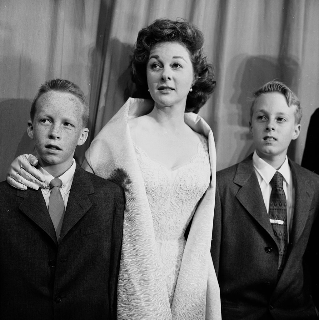 LOS ANGELES - MARCH 21, 1956: Actress Susan Hayward with sons Gregory and Tim attends the Academy Awards in Los Angeles, California. (Photo by Earl Leaf/Michael Ochs Archives/Getty Images)