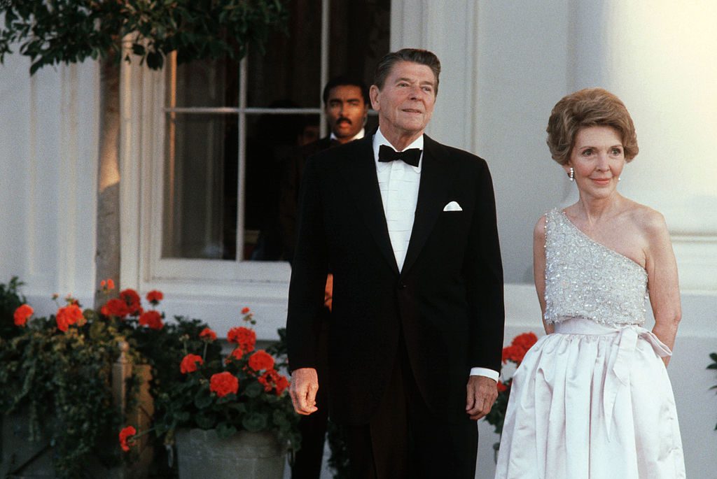 WASHINGTON - UNDATED: (NO U.S. TABLOID SALES) U.S. President Ronald Reagan and wife Nancy wait for the arrival of a Head-of-State guest at the North Portico of the White House in Washington, DC in this undated photo. (Photo by David Hume Kennerly/Getty Images)