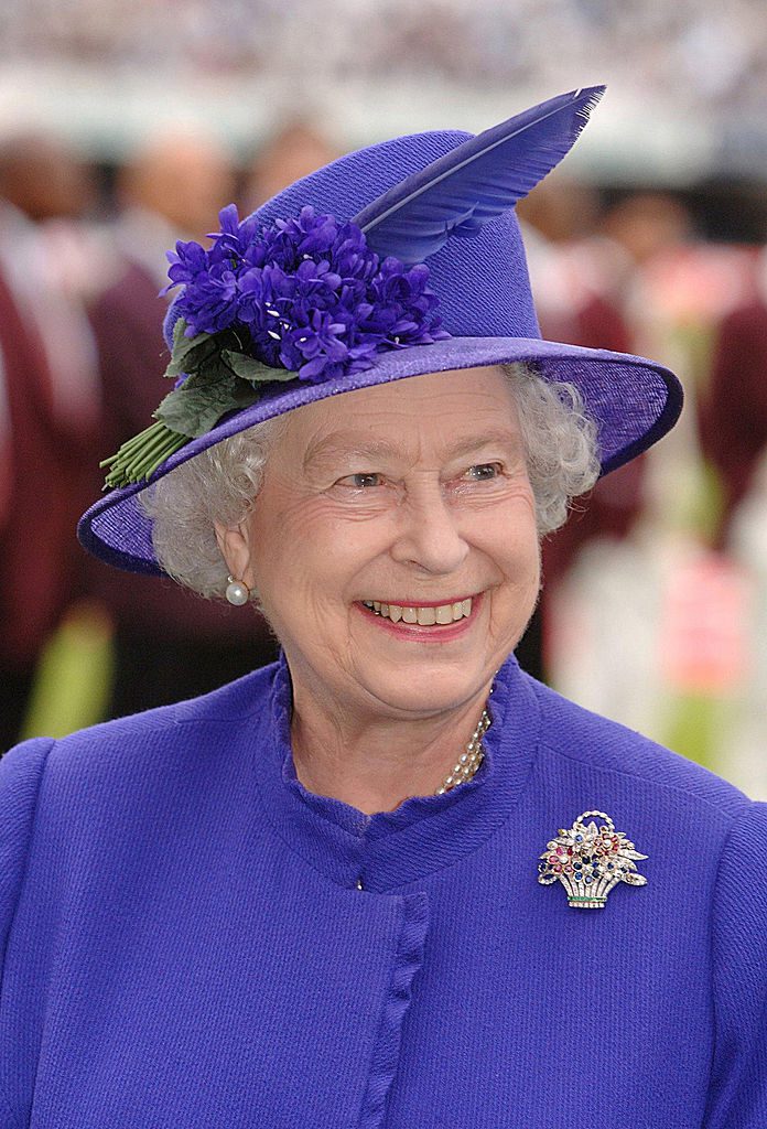 LONDON - MAY 17: (NO PUBLICATION IN UK MEDIA FOR 28 DAYS) Queen Elizabeth ll smiles as she is presented to the English and West Indian cricket teams during the first N-Power Test Match at Lords on May 17, 2007 in London, England. (Photo by Pool/Anwar Hussein Collection/Getty Images)