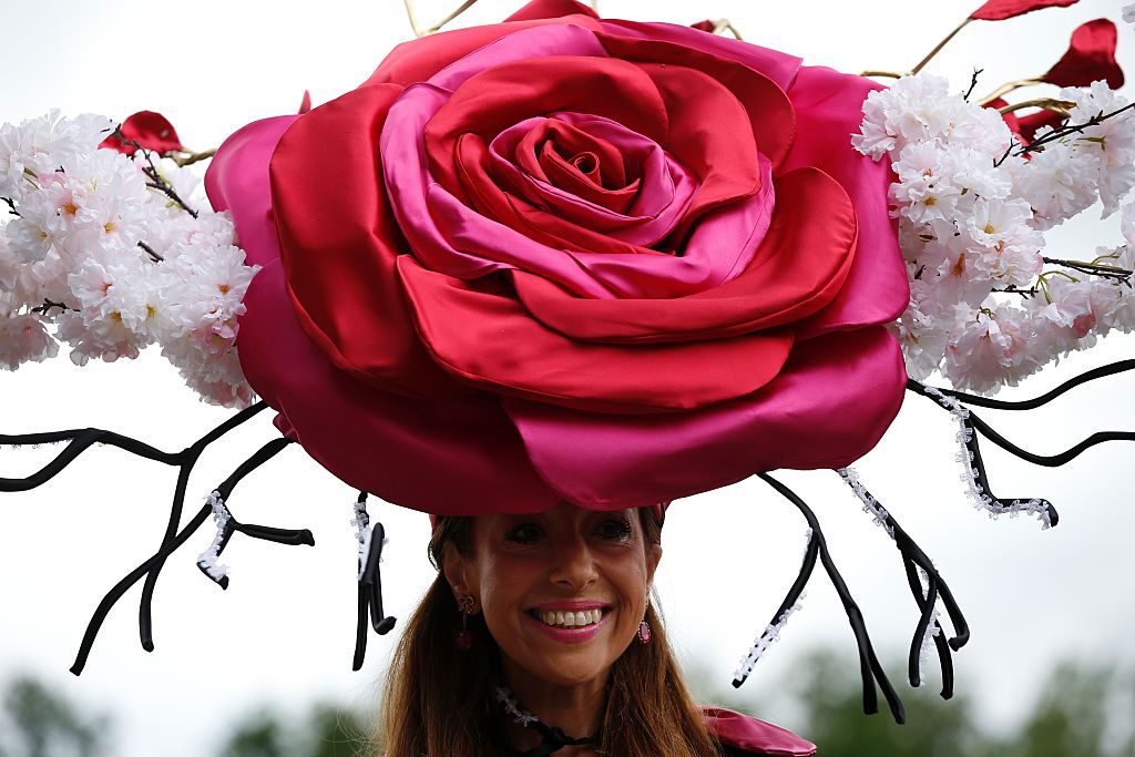 A racegoer poses for a picture during Ladies day at Royal Ascot in Ascot, west of London on June 16, 2016. The five-day meeting is one of the highlights of the horse racing calendar. Horse racing has been held at the famous Berkshire course since 1711 and tradition is a hallmark of the meeting. Top hats and tails remain compulsory in parts of the course while a daily procession of horse-drawn carriages brings the Queen to the course. / AFP / ADRIAN DENNIS (Photo credit should read ADRIAN DENNIS/AFP/Getty Images)