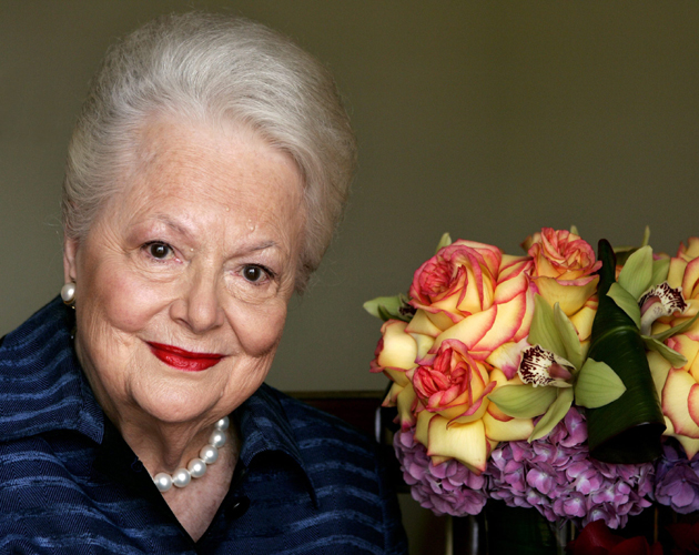FILE - In this Wednesday, Sept. 15, 2004, file photo, actress Olivia de Havilland, who played the doomed Southern belle Melanie in "Gone With the Wind," poses for a photograph in Los Angeles. In rare public remarks about her sister and fellow Oscar-winning actress, Olivia de Havilland mourned the loss of Joan Fontaine, with whom de Havilland reportedly feuded for much of their lives on Monday, Dec. 16, 2013. (AP Photo/Kevork Djansezian, File)