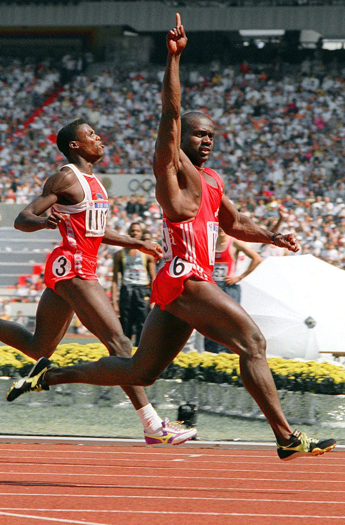 Jamaican-born Canadian Ben Johnson (c) crosses the finish line to win the Olympic 100m final in a world record 9.79 seconds 24 September 1988 at Seoul Olympic Stadium. Carl Lewis from USA (l) took second place. Johnson, nicknamed as "Human Bullet" for having become the fastest man in 1987 Rome's World Championships, after he had clocked a world record time of 9. 84 sec. He was banned for two years in Seoul after testing positive for the steroid stanolozol shortly after winning the 100m. Johnson made a comeback in 1992 at the Barcelona Olympics, only to test positive again a year later, this time for testosterone, incurring a life-time ban. In July 1997 the disgraced sprinter told the Argentinian newspaper La Nacion: "I know I am the fastest man in the world and no-one can deny it. My only mistake was to run too fast. Drugs cannot make you break a world record, they only improve you by 25 percent." / AFP / ROMEO GACAD (Photo credit should read ROMEO GACAD/AFP/Getty Images)