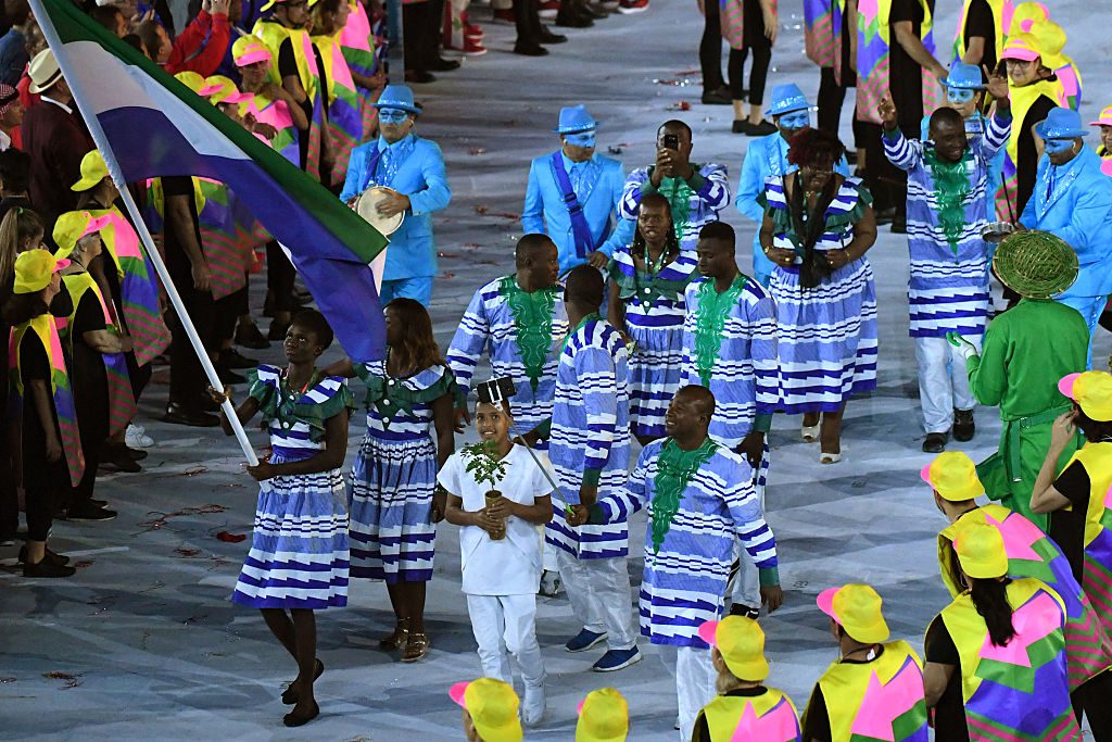 Sierra Leone's flagbearer Bunturabie Jalloh leads her delegation during the opening ceremony of the Rio 2016 Olympic Games at the Maracana stadium in Rio de Janeiro on August 5, 2016. / AFP / PEDRO UGARTE (Photo credit should read PEDRO UGARTE/AFP/Getty Images)