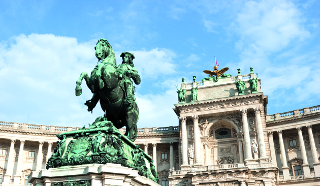 Dramatic wide angle view of the Hofburg Palace complex in Vienna, Austria (Statue of Price Eugene in the front)