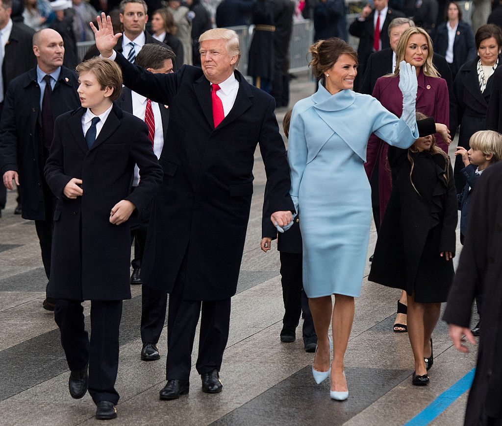 WASHINGTON, DC - JANUARY 20: President Donald Trump and first lady Melania Trump, along with their son Barron, walk in their inaugural parade on January 20, 2017 in Washington, DC. Donald Trump was sworn-in as the 45th President of the United States. (Photo by Kevin Dietsch - Pool/Getty Images)