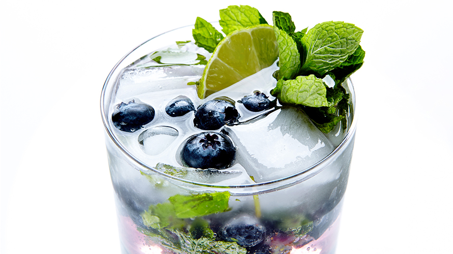 A blueberry mojito with fresh mint, sweet blueberries and lime. 