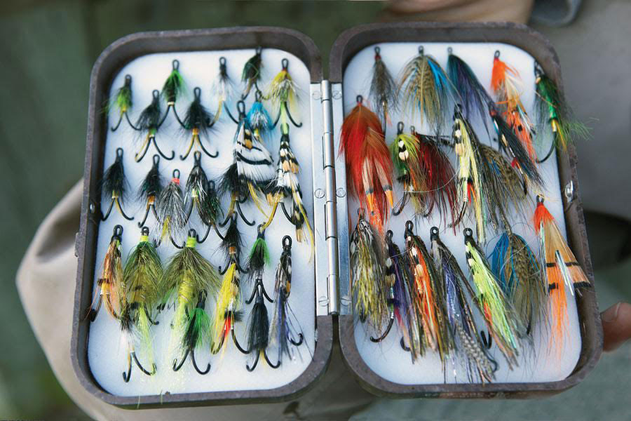 A box of multicoloured salmon flies. 