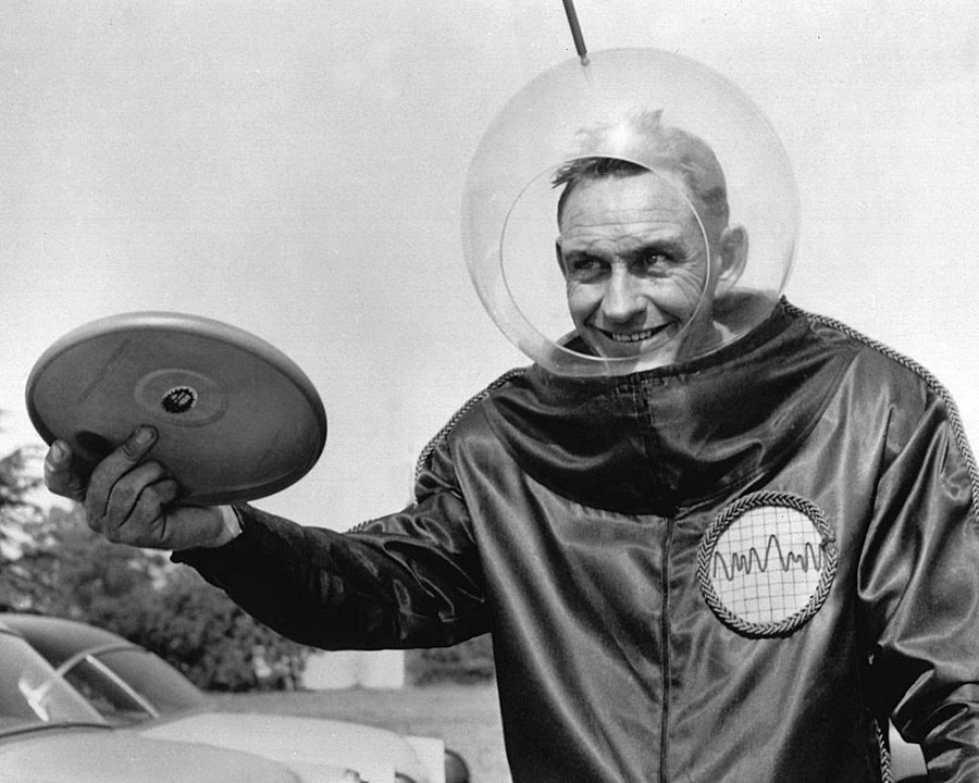 Walter Fredrick Morrison in a spacesuit holding the Pluto Platter, which was the forerunner to the fisbee.