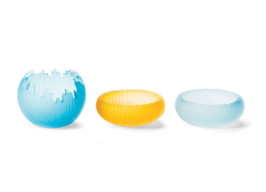 Three decorative glass bowls in pale blue and bright yellow