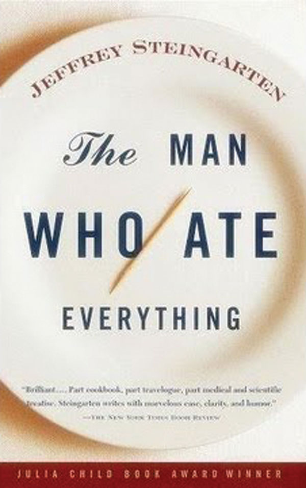 The book cover for The Man Who Ate Everything. The title is displayed on an empty plate save for a toothpick. 