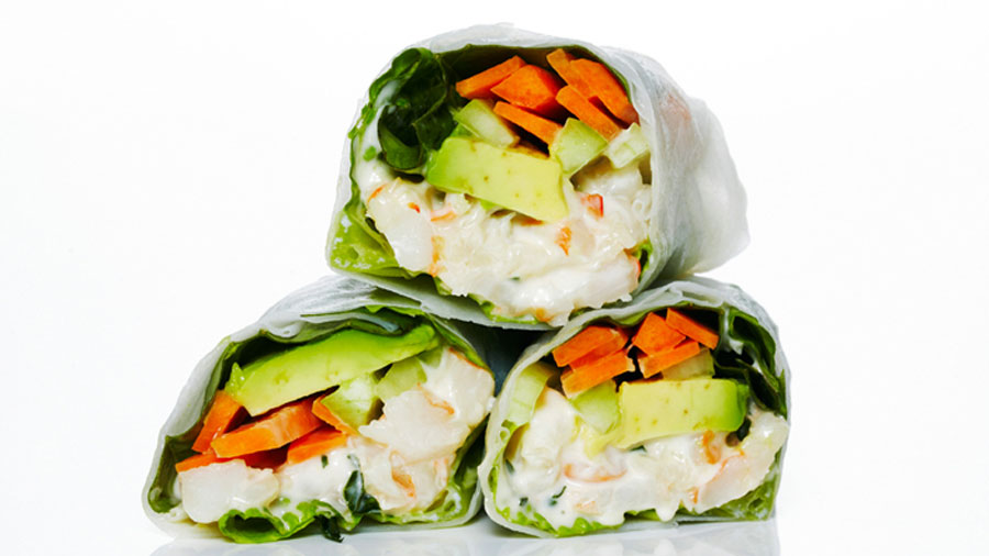 Shrimp Rice Paper Rolls filled with a zesty shrimp salad, creamy avocado and crunchy vegetables.