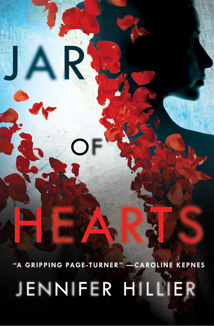 The book cover for Jar of Hearts. Flower pedals spread over a shadowed silhouette of a woman behind the title. 
