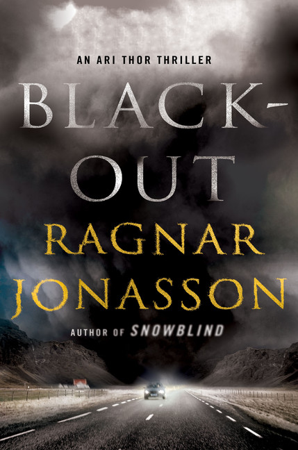 The book cover for blackout. In the background of the title is a cloudy night sky over a highway. 