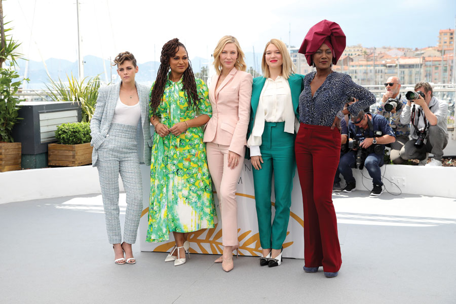 Jury members (left to right): Kristen Stewart, Ava DuVernay, Cate Blanchett, Léa Seydoux and Khadja Nin stand clad in in various pants suits. 