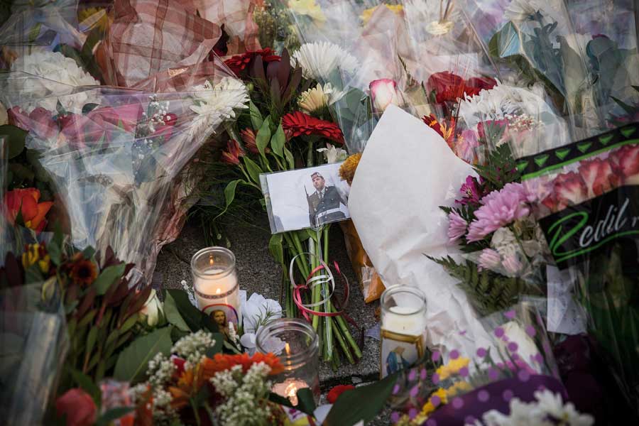 Cpl. Nathan Cirillo's photo surrounded by flowers and candles, part of a memorial on parliament hill. 