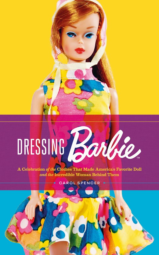 Book cover for Dressing Barbie featuring a red head doll wearing a colourful floral dress. 