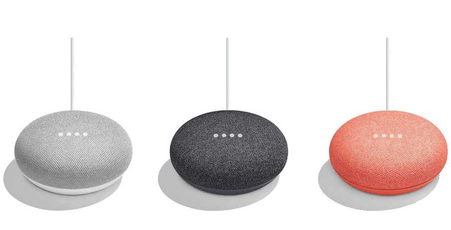 Three google homes in grey, black and peach. 