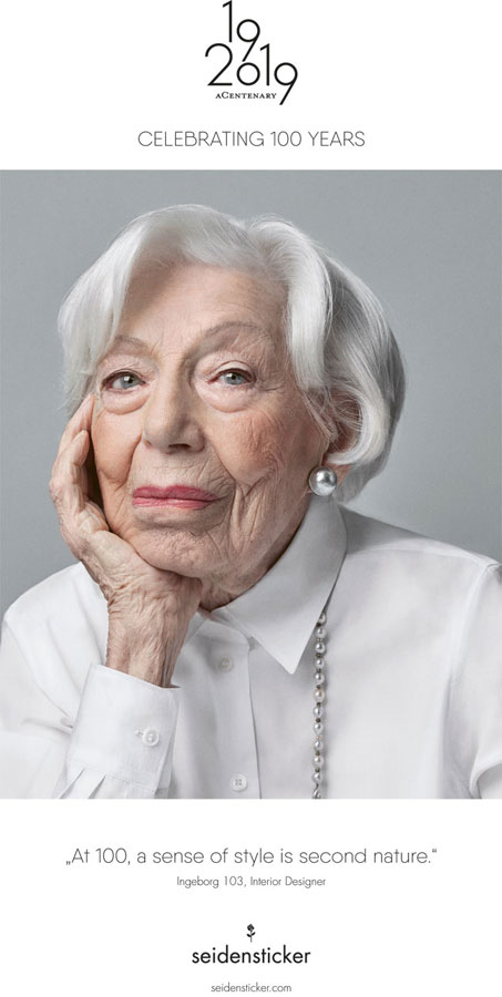 Ingeborg Wolf, 103, poses in a white dress shirt for Seidensticker's 100th anniversary ad campaign.