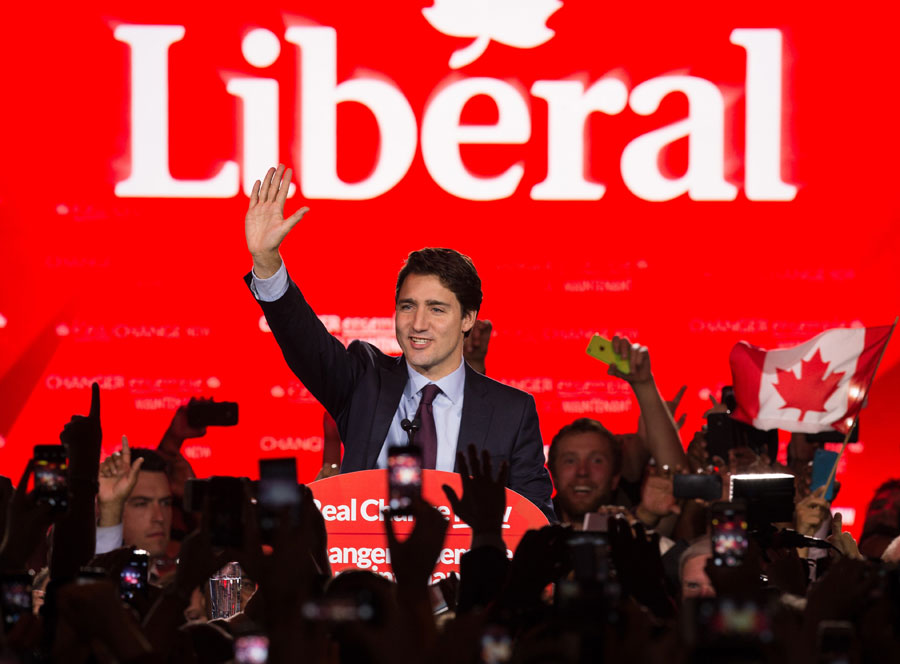 Canadian Liberal Party leader Justin Trudeau waves on stage in Montreal on October 20, 2015 after winning the general elections.