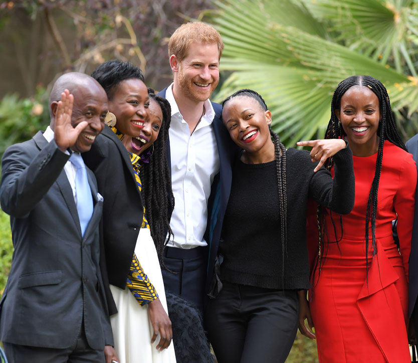 Prince Harry, Duke of Sussex poses for photos with attendees at a reception celebrating the UK and South Africa's important business and investment relationship at the High Commissioner's Residence. 