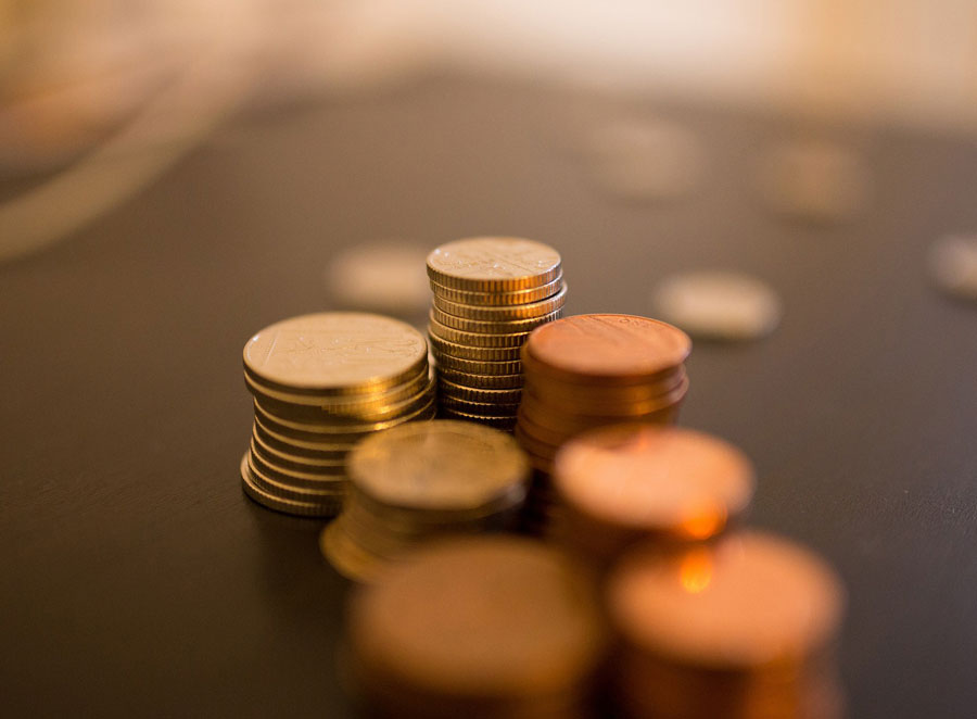Stacks of coins out of focus