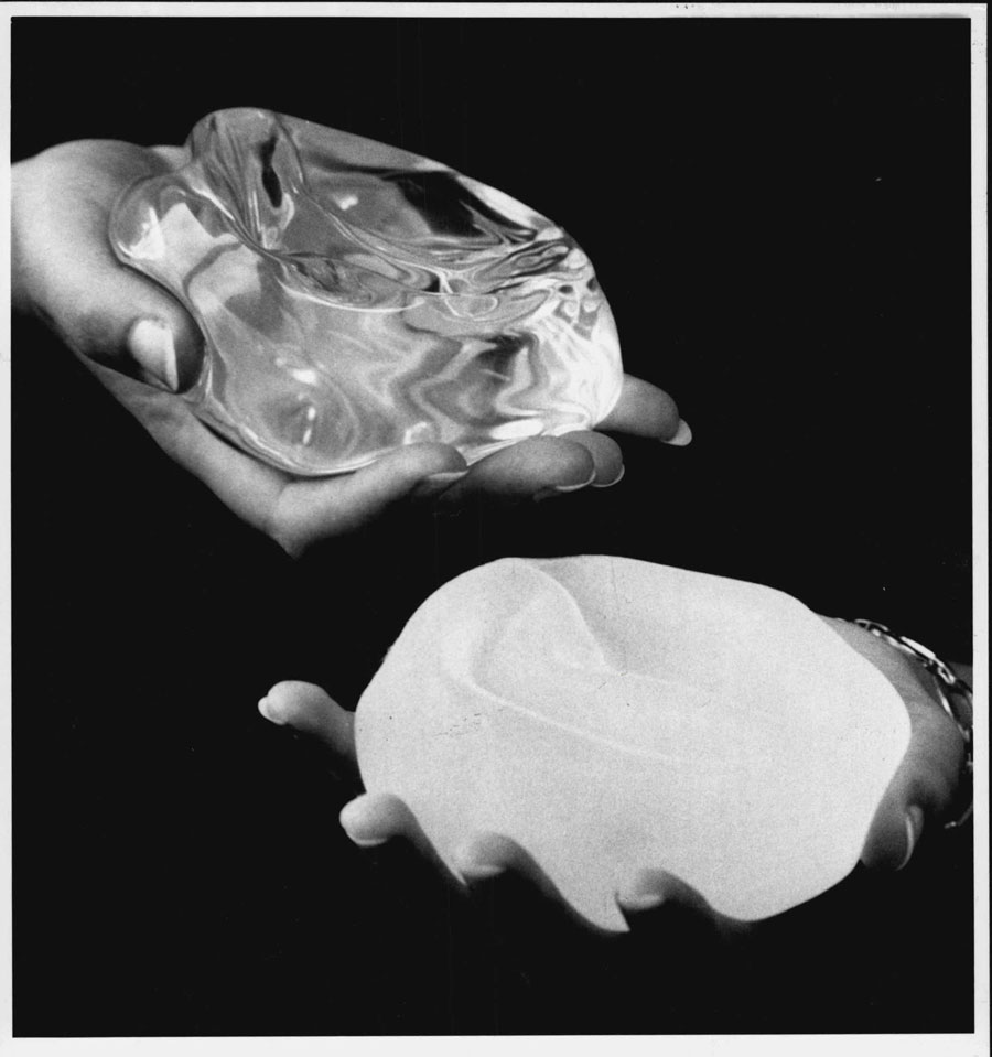 A 1992 photo showing a smooth implant, left, and a textured implant, right, the same year the U.S. Food and Drug Administration warned manufacturers that their products were unsafe