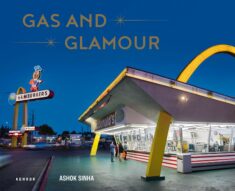 Book cover of a retro McDonalds, shot at a wide angle against a deep blue sky.